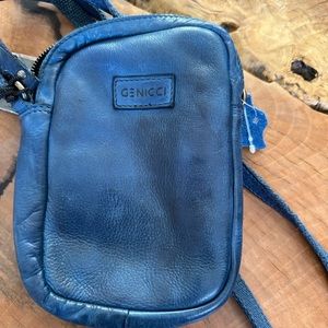 New with tags, blue Genicci purse/bag.